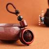 Llavero de coche nueva moda colgante creativo rueda giratoria de cuentas colgante de talla en palo de rosa accesorios de cuerda cordón tejido