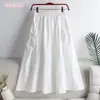 Falda 2023 nueva verano estilo coreano color liso con cordón de amarre bolsillo longitud media talla grande ropa de trabajo falda línea A para mujer