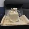 Otoño 2026 Nuevo Elegante Chic Tendencia Personalidad Cordón Cadena de Perlas Versátil Hombro Cruzado de Mano Bolso Cuadrado Pequeño