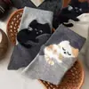 Calcetines de moda para otoño e invierno, calcetines lindos de gato para mujer, calcetines de estilo japonés ins de moda de terciopelo sintético hasta la pantorrilla, calcetines de dibujos animados de Zhuji