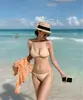Traje de baño nuevo de dos piezas transfronterizo color liso sexy estilo europeo y americano con tiras bikini de tres puntos en stock al por mayor