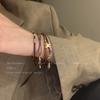 Serie marrón ~ Pulsera retro trenzada de cuerda con cuentas para mujer Otoño e Invierno 2024 Nuevo Estilo Étnico de Orquestación Pulsera Apilada