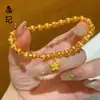 Tienda de oro con cuentas de transferencia de color esmalte de arena dorada antigua doble feliz cobre chapado en oro moda gato Joker ojo de gato pulsera al por mayor