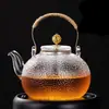 Tetera de vidrio de borosilicato alto a prueba de explosiones a alta temperatura patrón martillado transparente cafetera casera asa de cobre asa asa viga olla juego de té al por mayor