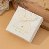 Fábrica en stock, caja de embalaje de joyería con lazo blanco de arroz, caja de anillo, caja de regalo para pendientes, collares y pulseras, caja de joyería al por mayor