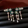 Pendientes de borla con flor de trébol de circonita vintage con un toque de alta gama, pendientes versátiles y de moda al por mayor