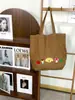 Bolsa de ombro em jeans lavado divertida e charmosa para outono e inverno, bolsa tote vintage com bordado de desenho animado desgastado, bolsa de tecido jovem e versátil
