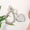 Llavero Espejo Forma de Corazón con Lazo Plateado Estilo Ins Colgante para Bolso Accesorio de Alta Gama Espejo de Maquillaje para Mujeres