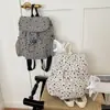 Mochila estampada nueva, elegante y versátil 2026, una bolsa de viaje de gran capacidad para mujeres, perfecta para ir al trabajo y para salidas.