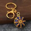 Llavero de estilo étnico con patrón octagonal, goteo de aceite e incrustaciones de diamantes, colgante de patrón vintage, regalo de recuerdo de viaje al por mayor