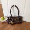 Bolso bandolera de gran capacidad para baguette con cinturón, textura vintage, piel de cera de aceite, color sólido, moda de primavera 2026 nuevo para mujer