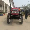 Tractor Pequeño de Cuatro Ruedas Monocilíndrico de 25 Caballos de Fuerza con Llantas Agrícolas para Trasplante en Invernadero, Aspersión y Rotocultivo, con Distancia entre Ejes Alta que No Aplasta las Plantas