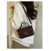 Bolsa de mão feminina 2026 nova tendência moda delicada listrada retalhada bolsa tote versátil nicho ombro transversal