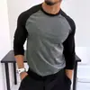 Hombre musculoso estilo americano, colorblock otoño e invierno, capa base casual de manga larga para deportes y fitness, estilo minimalista