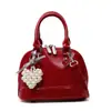 Bolsa de Concha Portátil Cor Sólida Versátil de Nicho Feminina Nova Primavera e Verão 2025 Pequena Exquisite Fashion Bolsa de Ombro Transversal