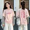 Camiseta de manga larga tipo dos piezas de imitación para niños, colección otoño 2026, para niñas, 100% algodón, cuello redondo, corte holgado, diseño lindo de caricatura, top básico
