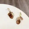 Coreia do Sul Dongdaemun mesmo estilo concha natural cortada redonda brincos de franja originais primavera novo brincos de metal fosco
