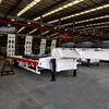 Venta de Precio de Descuento Buena Calidad 3 Ejes Transporte de Equipo Pesado Camión Plataforma 70 Toneladas 45 Pies Máquina de Gancho Placa Semirremolque