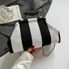 2026 Nova Bolsa Nuvem Bolsa de Mão Feminina Bolsa de Tricô Listras Simples Estilosa Alta Aparência Bolsa Feminina Estilosa para Praia