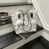 Bolsa Tote de Mão Graffiti Feminina 2025 Outono e Inverno Nova Bolsa de Ombro Casual Grande Capacidade Bolsa de Axila Transversal