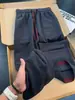 Calça casual jacquard texturizado de cor contrastante com múltiplos bolsos para homens, estilo americano, outono, fina, respirável, reta, solta, perna larga