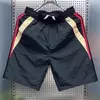 Shorts casuales de verano para hombres y mujeres, marca de moda ins holgados casuales de moda pantalones de longitud media, pantalones versátiles de estilo coreano de cinco puntos