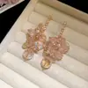 Aretes de aguja plateada con colgantes de borlas de diamante, circonita y cristal, aretes estilo resort de playa, aretes de lujo ligero de alta gama al por mayor