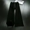 Pantalones de chándal de cuadros patchwork deconstruidos negros para hombre, marca de tendencia de otoño, pantalones rectos de alta gama que estilizan, pantalones de microcampana estilo americano