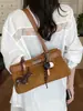 Bolsa tote de camurça transfronteiriça para mulheres, novo modelo 2026, versátil para o trabalho, grande capacidade, toque de alta qualidade, bolsa de mão, bolsa de ombro, bolsa de axila