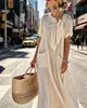 Vestido Soltinho de Manga Curta Estilo Europeu e Americano Novo Verão 2026 com Gola Laço e Bolsos, Vestido Longo Elegante e Estiloso