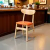 Sillas de comedor de madera maciza estilo nórdico con respaldo de mariposa, diseño simple y moderno, adecuadas para uso doméstico, restaurantes y entornos de comedor informal.; disponible para venta al por mayor