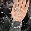 Creativo nuevo colgante de garra de gato estrella de cinco puntas mariposa funda de teléfono llavero cordón colgante cadena anticaída accesorios de joyería