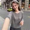 Suéter de punto calado con cuello redondo para mujer, nuevo estilo primavera y otoño 2026, holgado y casual, versátil, de manga larga, fino, top básico