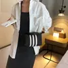Bolsa pequena portátil listrada da moda popular deste ano para mulheres 2023 nova bolsa quadrada pequena casual simples bolsa transversal versátil