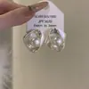 Pendientes de botón de perla redonda retorcida con pasador de plata, joyería de lujo ligero, moda de alta gama, pendientes simples, pendientes versátiles de temperamento, nicho para mujer