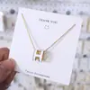 Colar H de luxo leve coreano e japonês com pingente de gota de óleo para mulheres, gargantilha simples e elegante de aço titânio, acessório de corrente para clavícula versátil e que não desbota