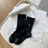 Calcetines de gato negro con bordado de dibujos animados versión coreana de principios de primavera 2025 al por mayor transpirables Joker algodón fino calcetines de mujer