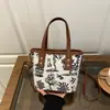 Bolso de Moda Estilo Chino con Gran Capacidad, Nuevo Versátil Lona para Viajes Diarios Bolso de Hombro Tote para Mujer Primavera y Verano 2026