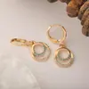 Europa y Estados Unidos transfronterizos nuevo comercio exterior chapado en cobre oro real incrustado circonita aretes moda personalidad nicho temperamento joya para el oído venta al por mayor