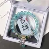 Pulseras para estudiantes al por mayor, pulseras de cuentas de cristal de camelia, populares accesorios de mano de margaritas pequeñas de colores para puestos del mercado nocturno