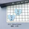 En Stock Venta al por Mayor Transparente Forma de Corazón Resina Pequeños Accesorios Resina Pedrería Pasador Llavero Accesorios para Bolsos Estilo Colgante