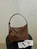 Bolsa transversal de ombro único casual personalizada da moda, textura simples, novo modelo de bolsa, bolsa almofada feminina da moda para o verão de 2026