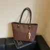 Bolsa versátil de alta qualidade com moda retrô para mulheres 2026 nova bolsa de ombro tote simples com textura e grande capacidade