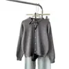 Nuevo cárdigan de punto con cuello redondo y decoración de bufanda estilo coreano para otoño para mujer, holgado y suave, suéter abrigo juvenil