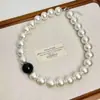 Collar coreano nuevo de colores blanco y negro a juego con perlas de imitación, cadena para la clavícula exagerada de alta gama, estilo niche estrella, a la moda
