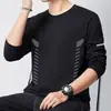 Camiseta informal de manga larga con cuello redondo, color liso, versátil, para hombre, otoño 2026, corte holgado, top moderno