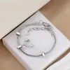Moda simple transfronteriza para mujer, pulsera de mano, accesorio creativo para auriculares, colgante, pulsera, venta al por mayor, primera generación de pelo