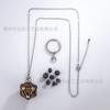 Suministro directo transfronterizo DND6MM mini juego de colgantes de dados huecos de metal TRPG juego de mesa de carrera dados multifacéticos