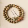 Sándalo verde DIY anillo de correr pulsera especificaciones 0.6 para hombre y mujer estilo simple cuentas Wen jugar joyería fabricantes al por mayor cuentas de Buda
