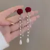 Pendientes de Perlas con Lazo Rojo para Otoño e Invierno Pendientes de Alta Gama para Mujer 2025 Nuevo Estilo Chino Pendientes Rojos